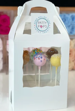 gable shaped white cake pop box with handle on top and die-cut window on front panel and inside die cut punch partition inserts